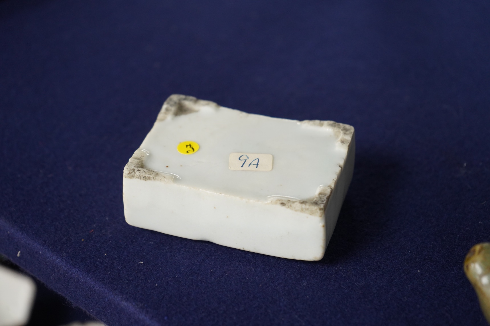 Two 19th century Korean ceramic water droppers and a Korean turned wood cup stand, oval water dropper 8cm long